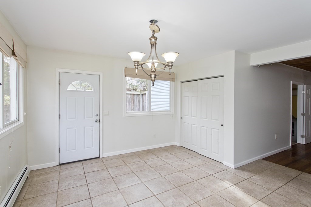 606 County Road Holyoke, MA 01040 - Photo 19 of 20 a view of an empty room with window and chandelier