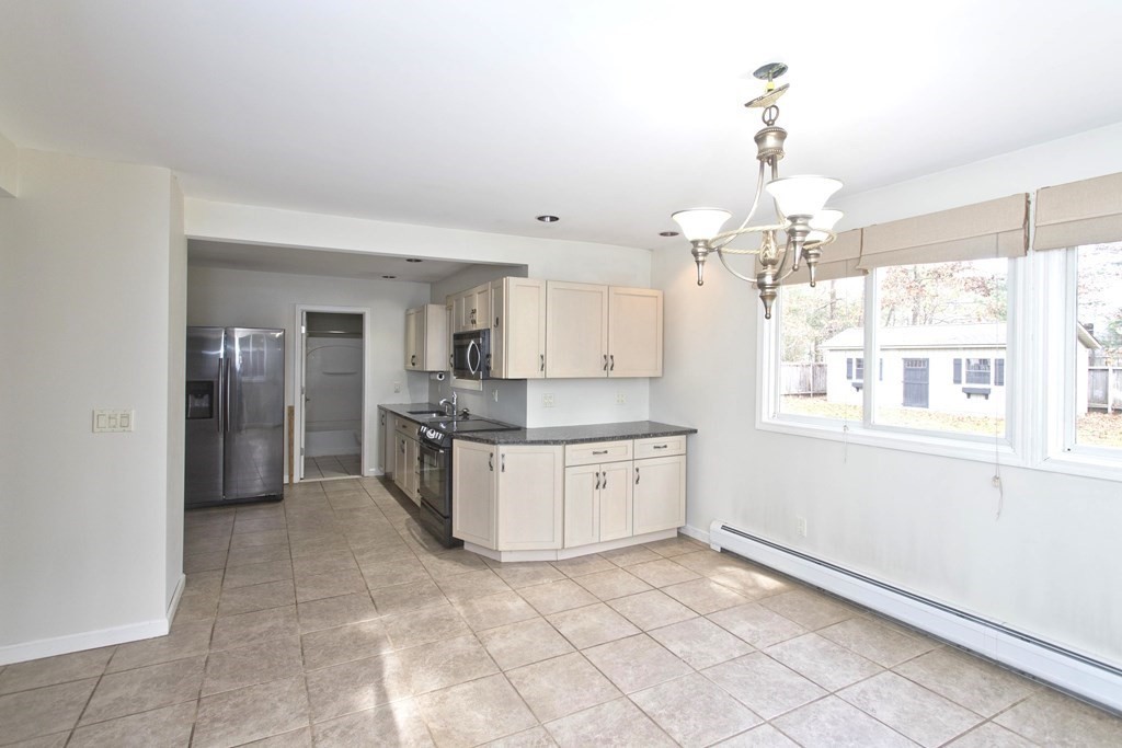 606 County Road Holyoke, MA 01040 - Photo 6 of 20 a large kitchen with granite countertop a large counter space and stainless steel appliances