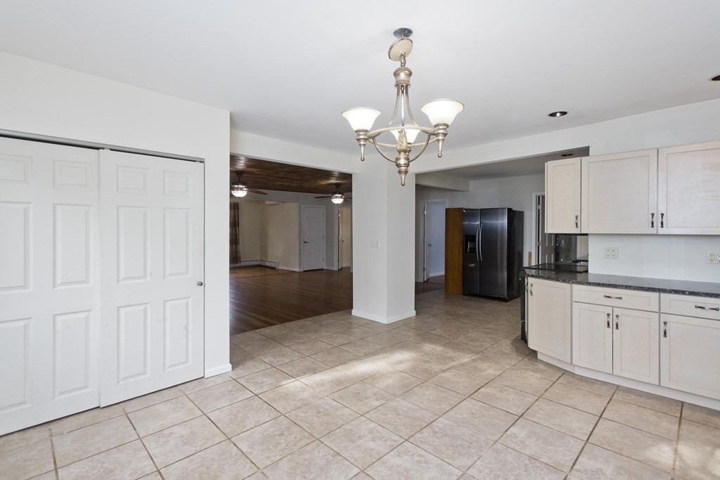 606 County Road Holyoke, MA 01040 - Photo 7 of 20 a view of a kitchen with cabinet and refrigerator