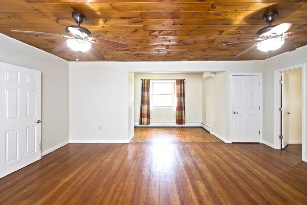 606 County Road Holyoke, MA 01040 - Photo 10 of 20 wooden floor in an empty room with a window