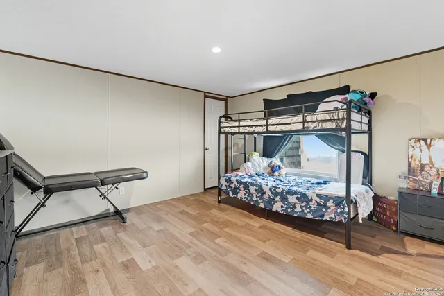 a room with lots of furniture and a chandelier