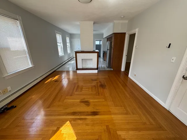 a view of a kitchen with wooden floor