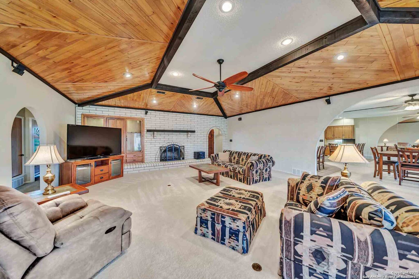 8300 Scr 314 Rocksprings, TX 78880 - Photo 31 of 74 a living room with furniture a flat screen tv and kitchen view