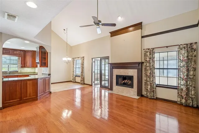 a view of a livingroom with a fireplace and window