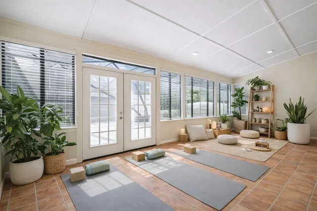 a living room with furniture and a potted plant