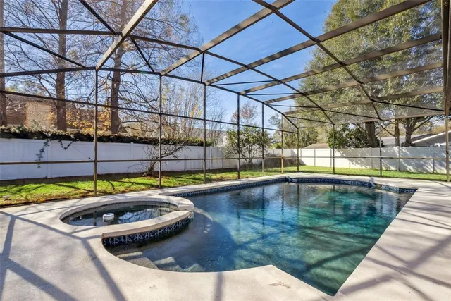 a view of swimming pool with a yard