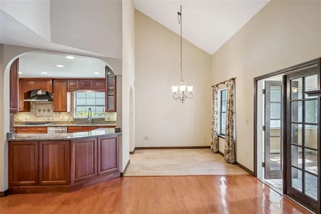 a view of a kitchen with a sink and a window