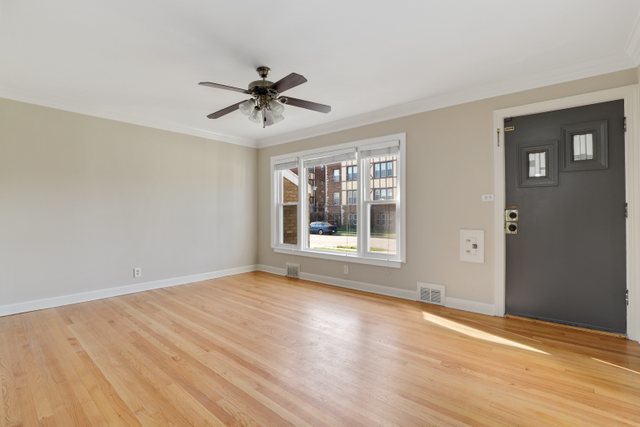 8012 Edgewater Road North Riverside, IL 60546 - Photo 8 of 22 a view of empty room with wooden floor and fan