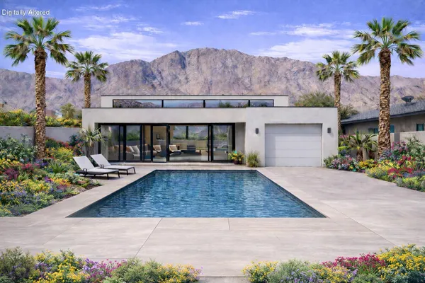 a view of a house with a yard and sitting area
