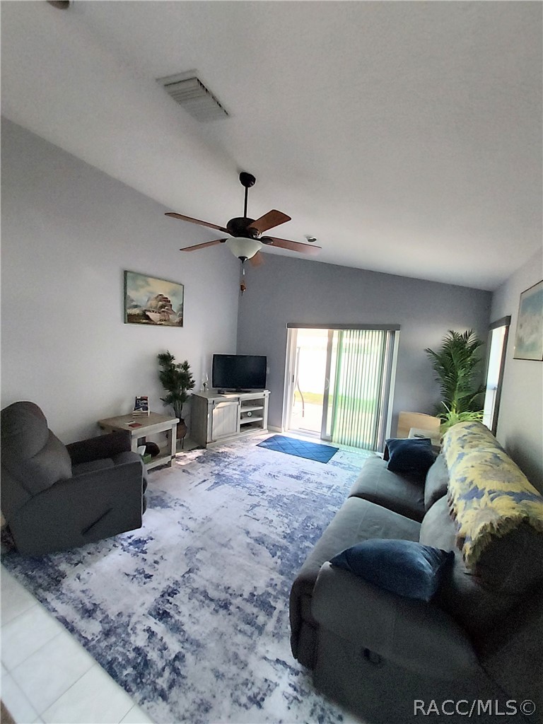 9306 East Gospel Island Road Inverness, FL 34450 - Photo 12 of 16 a living room with furniture and a large window