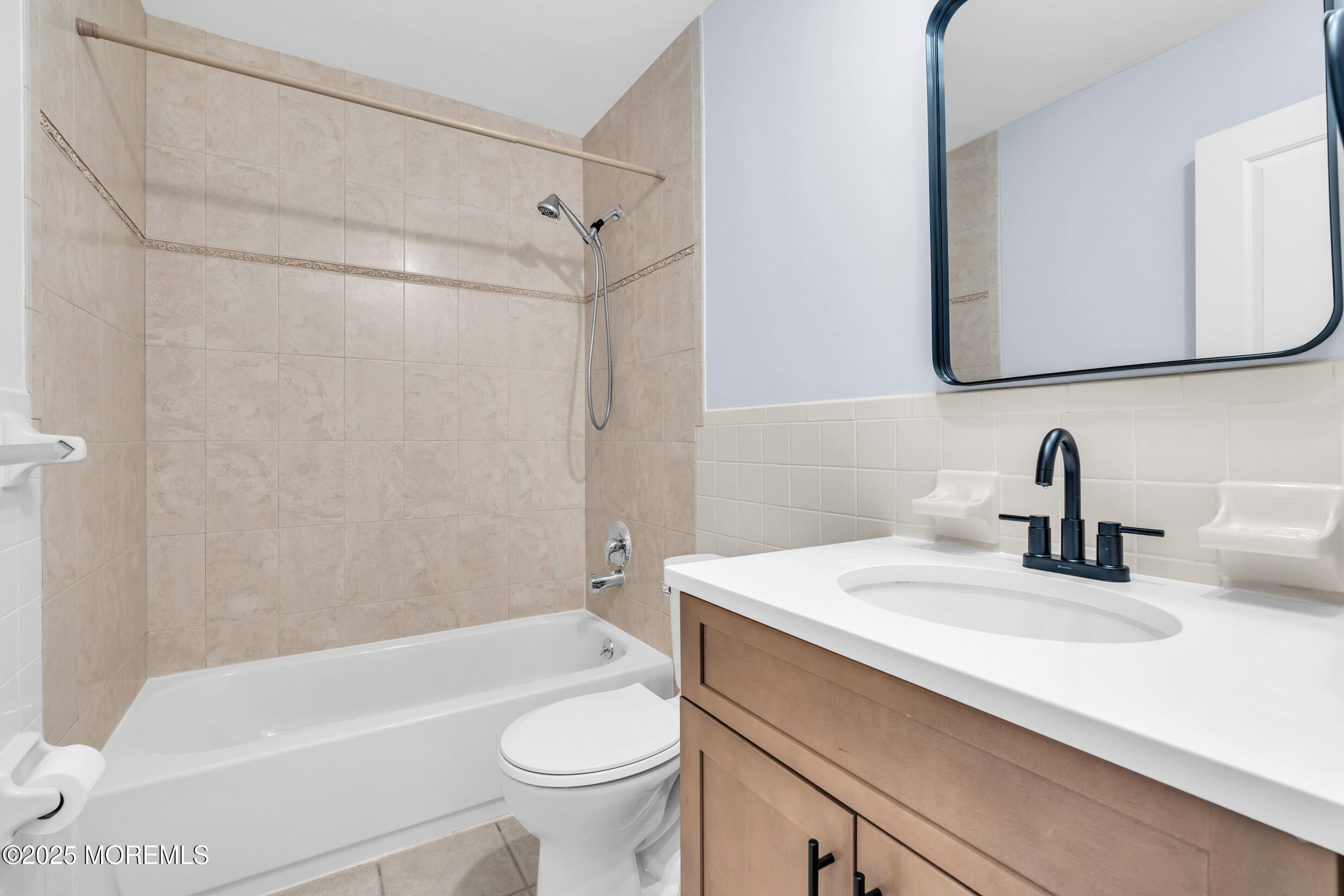 1617 Raspberry Court Edison, NJ 08817 - Photo 17 of 29 a bathroom with a sink a toilet and a mirror