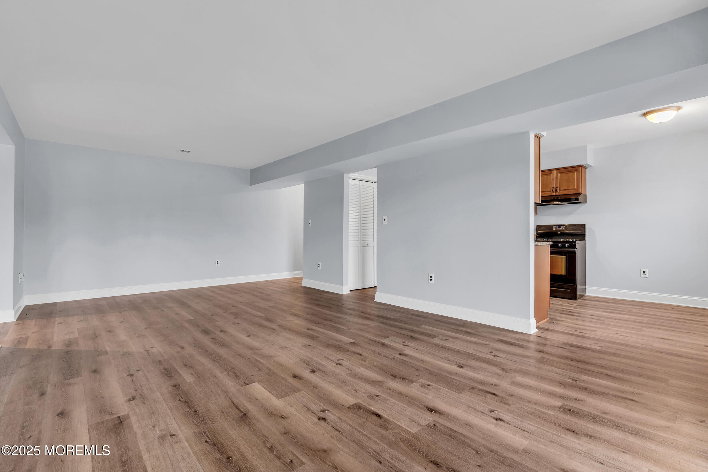 1617 Raspberry Court Edison, NJ 08817 - Photo 19 of 29 a view of an empty room with wooden floor and a window