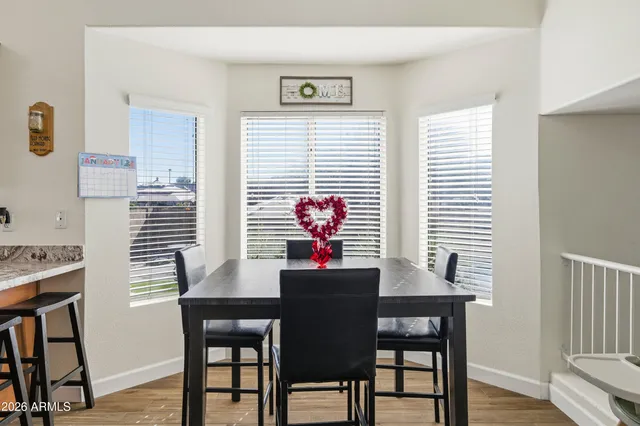a dining room with furniture and window