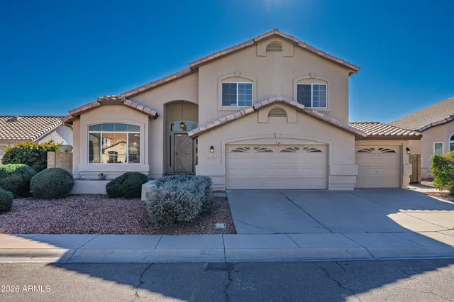 a front view of a house with garage