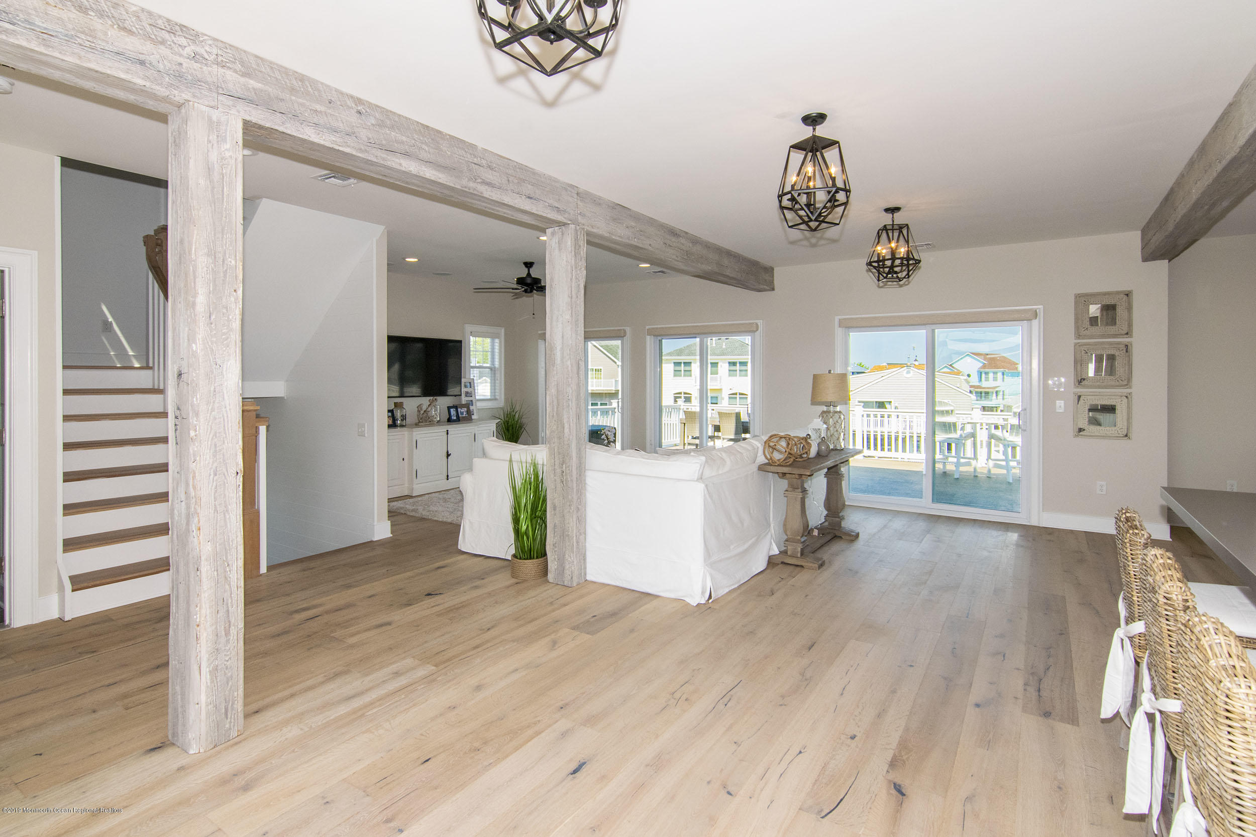 30 Ward Drive Brick, NJ 08723 - Photo 18 of 61 a view of a hallway with wooden floor and a kitchen