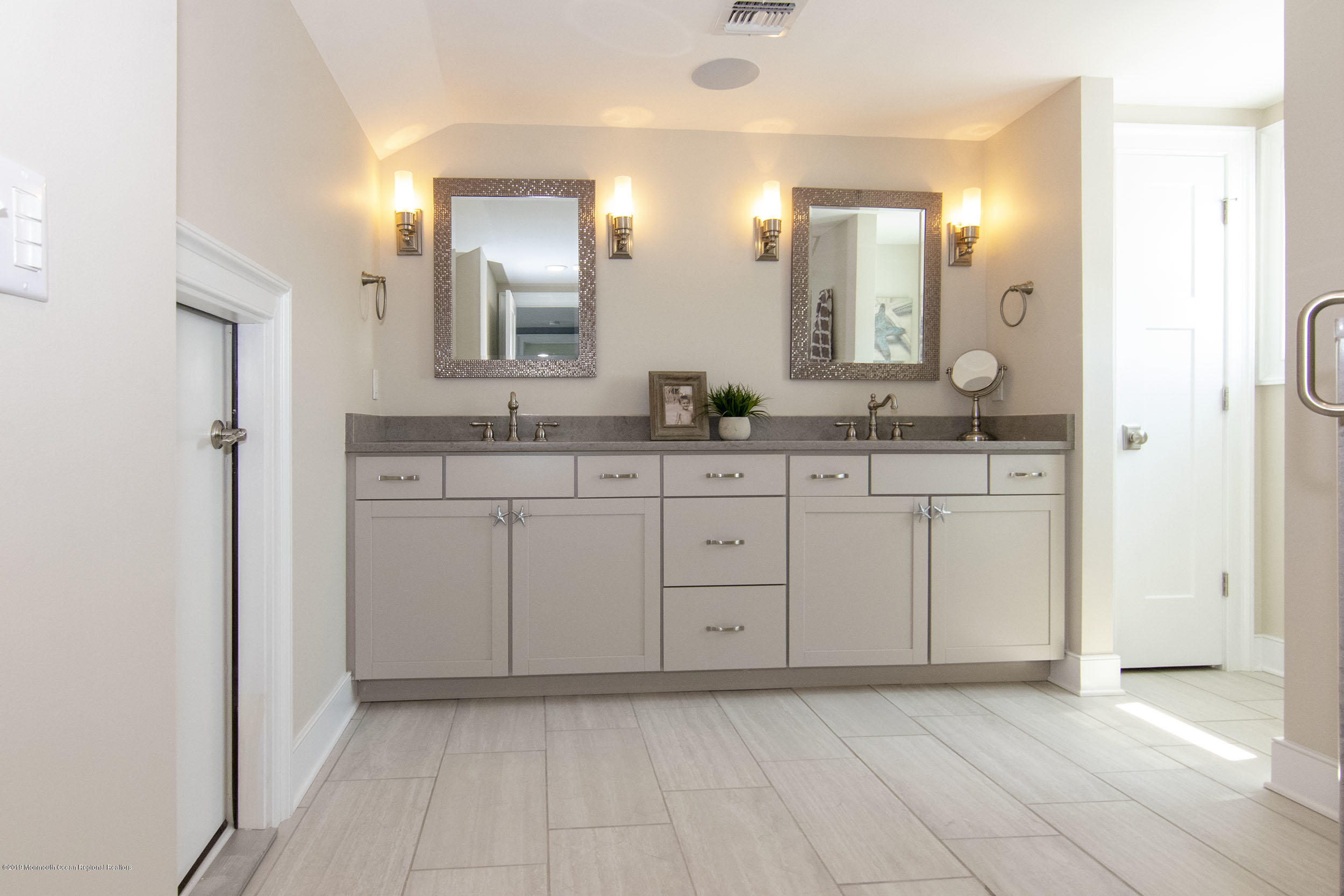 30 Ward Drive Brick, NJ 08723 - Photo 33 of 61 a spacious bathroom with a granite countertop sink and a mirror