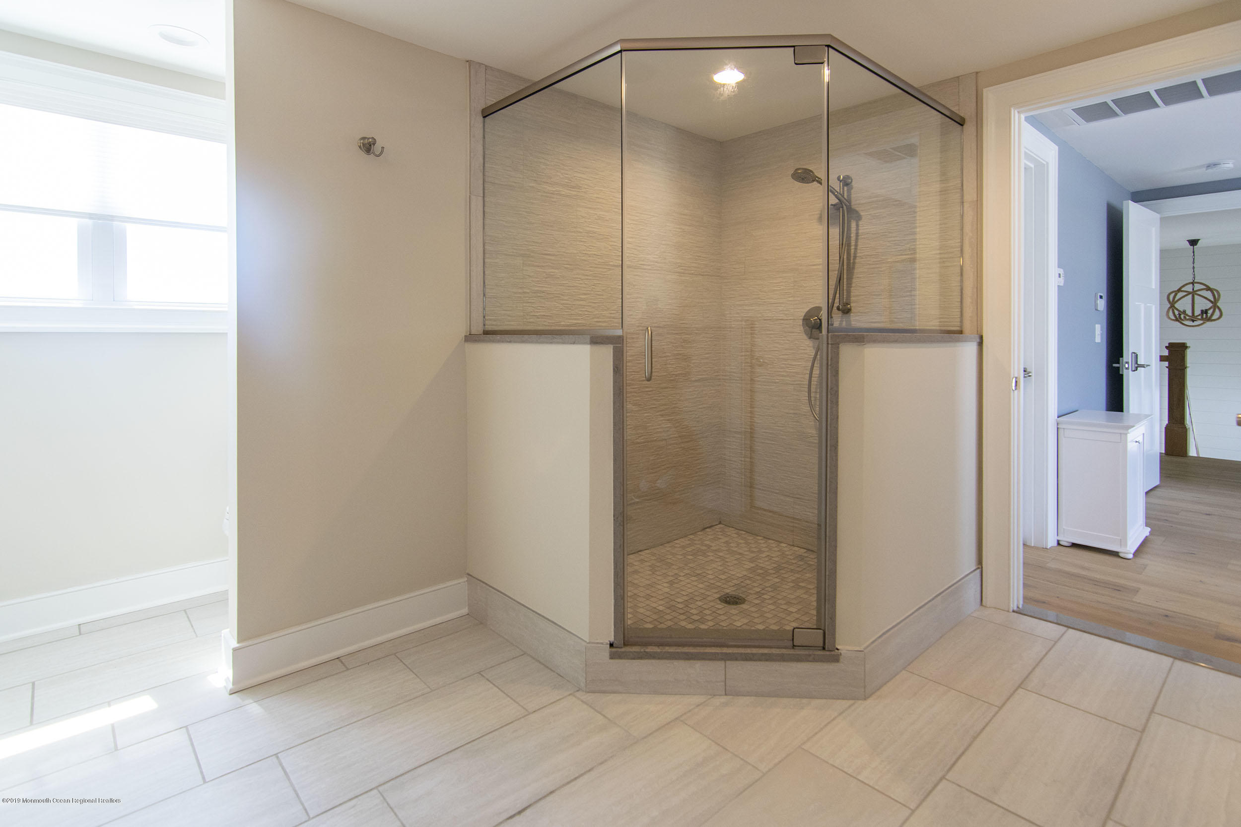 30 Ward Drive Brick, NJ 08723 - Photo 34 of 61 a bathroom with a shower and a glass door