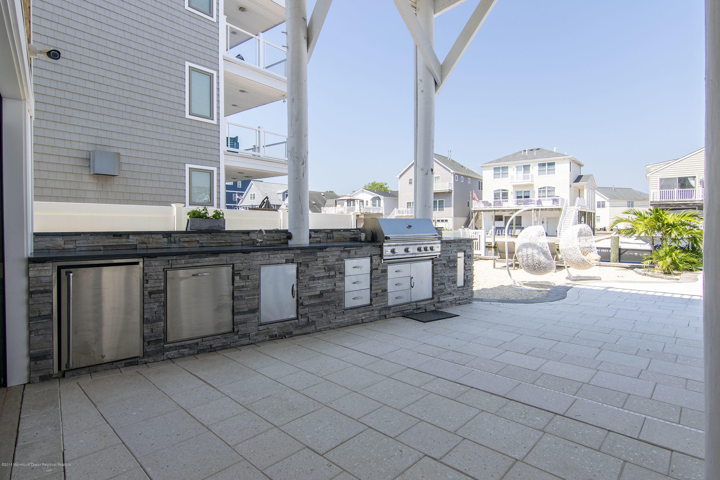 30 Ward Drive Brick, NJ 08723 - Photo 39 of 61 a kitchen with stainless steel appliances granite countertop a stove and a sink