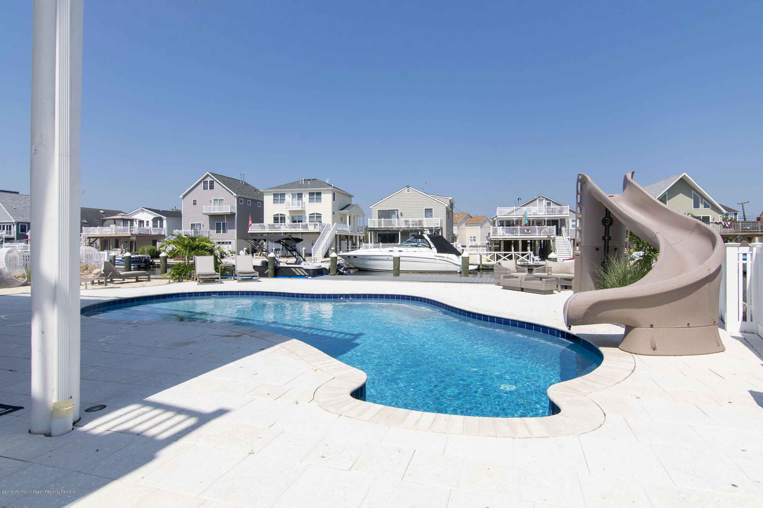 30 Ward Drive Brick, NJ 08723 - Photo 41 of 61 a view of a living room with furniture and a floor to ceiling window