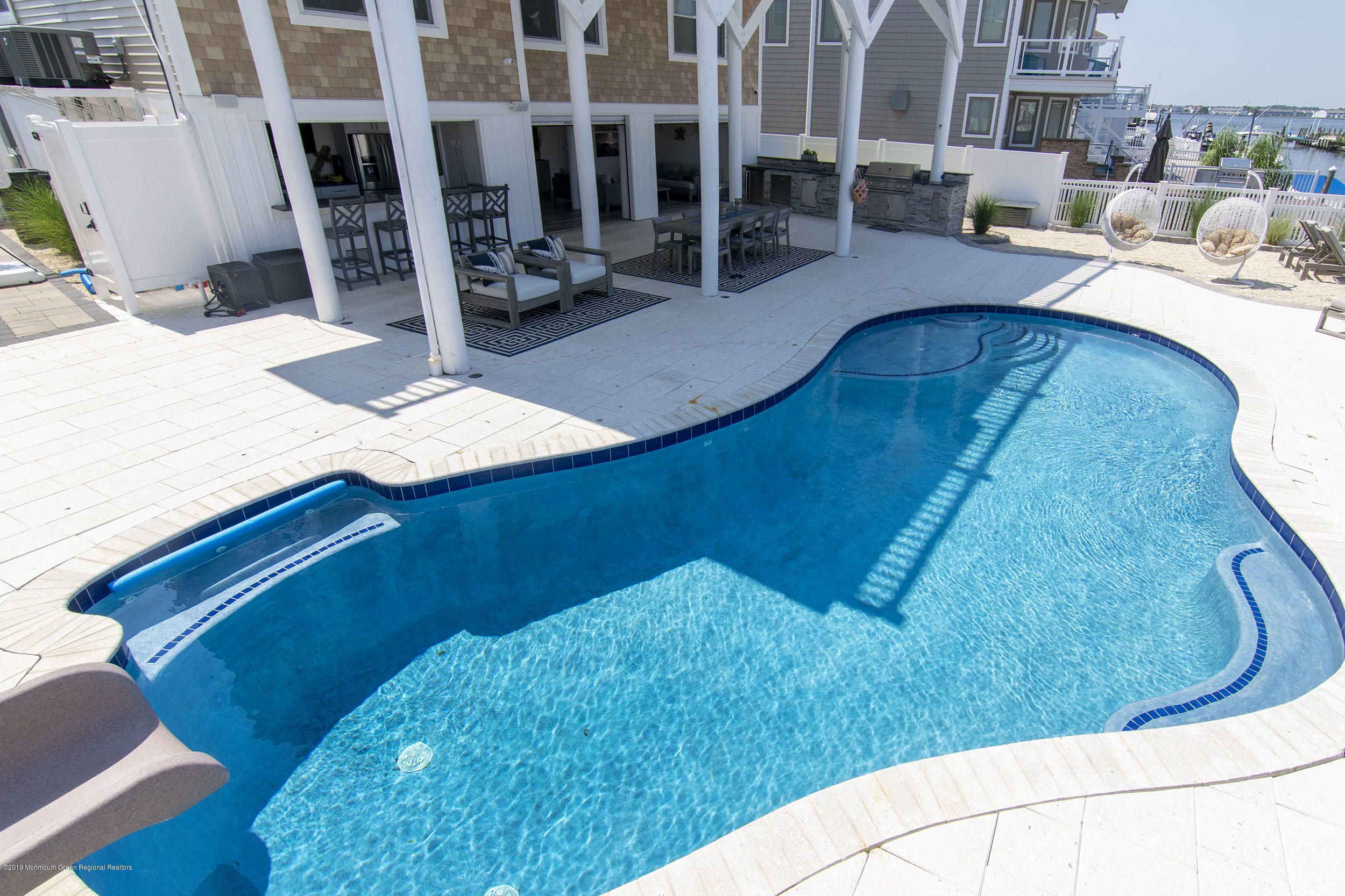 30 Ward Drive Brick, NJ 08723 - Photo 45 of 61 a view of living room kitchen with furniture and floor to ceiling window