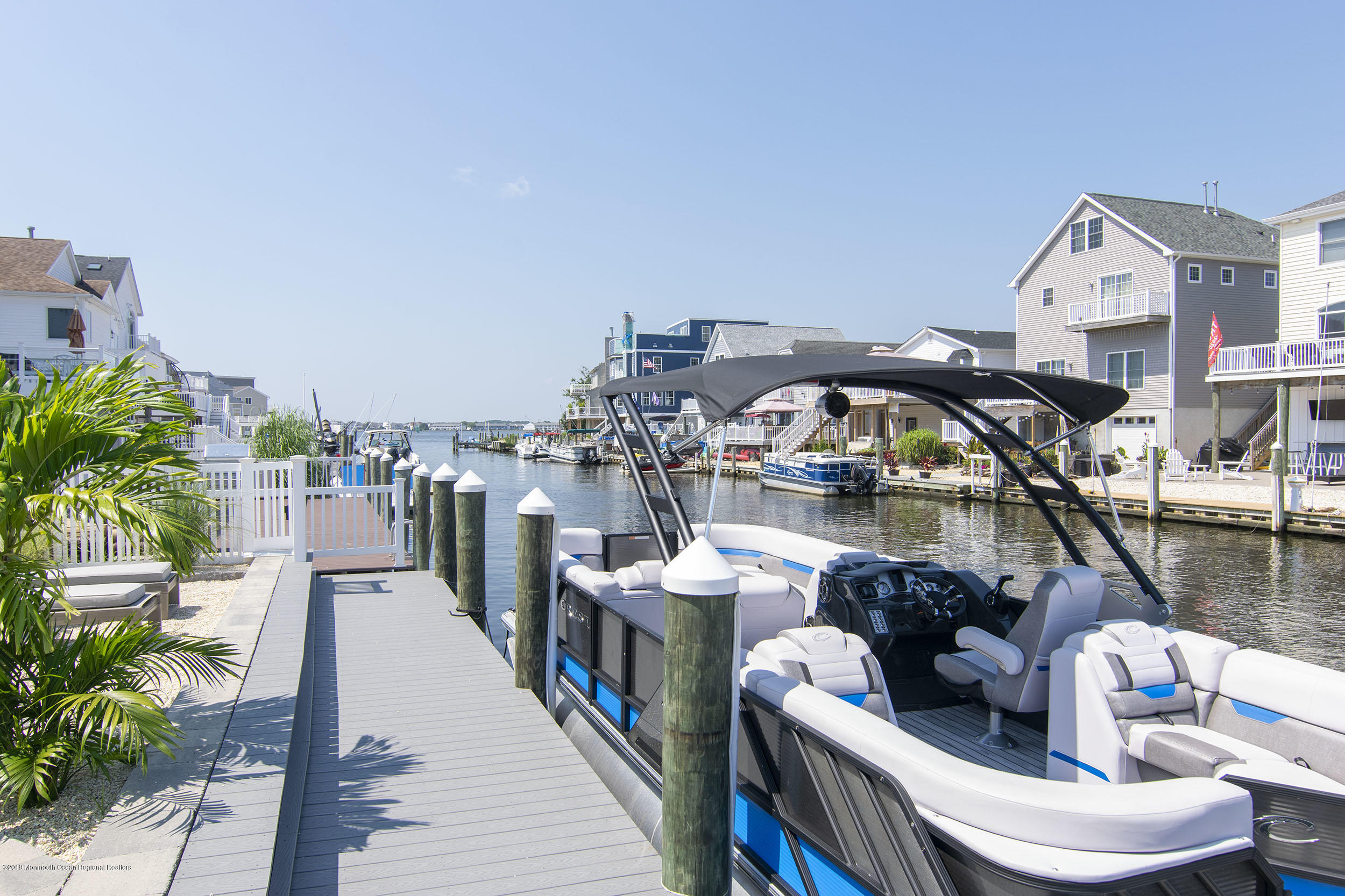 30 Ward Drive Brick, NJ 08723 - Photo 48 of 61 a view of a balcony with two chairs and a potted plant
