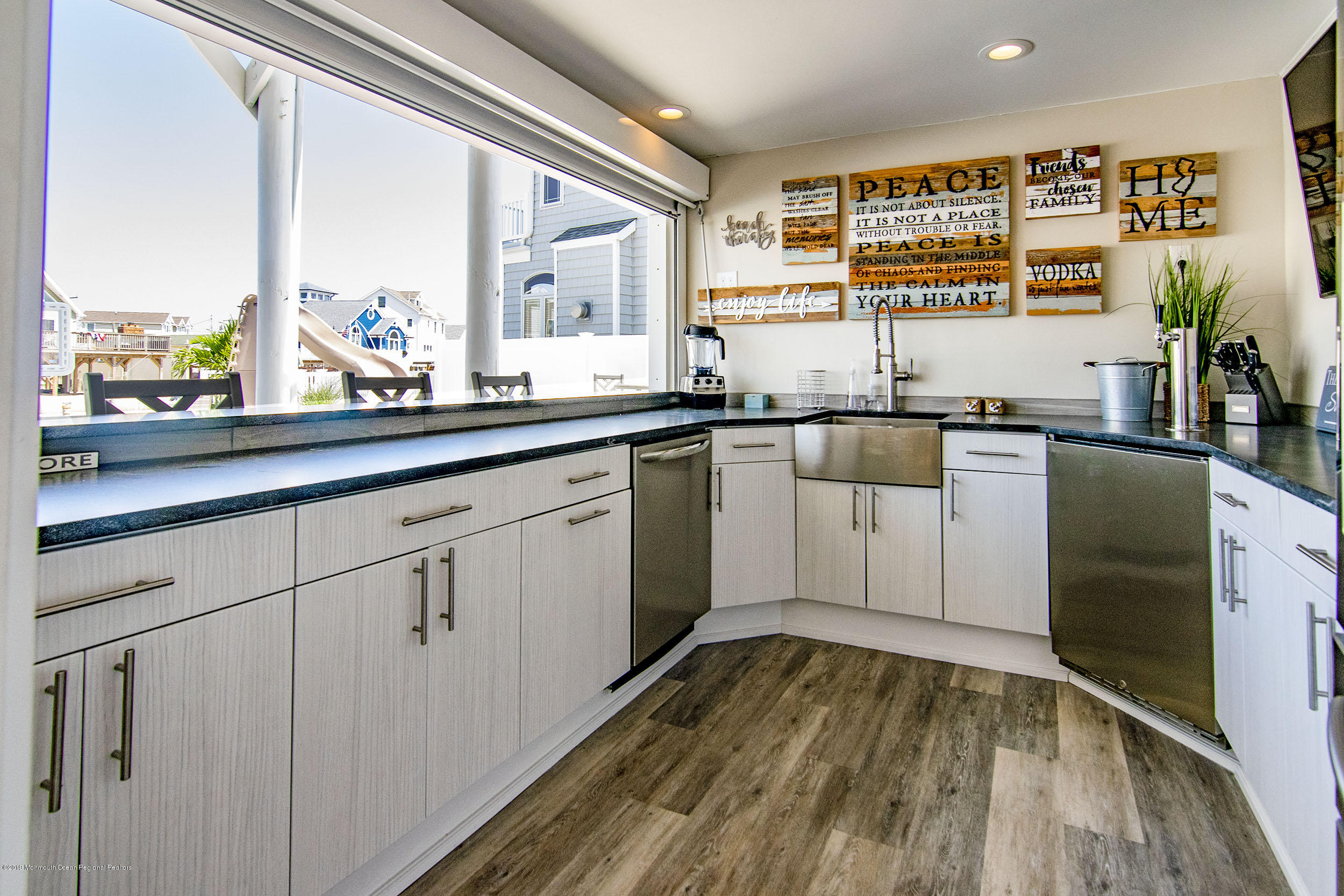 30 Ward Drive Brick, NJ 08723 - Photo 10 of 61 a kitchen with a sink window and cabinets