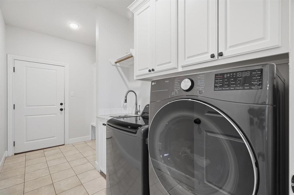 163 Homestead Road Tuscola, TX 79562 - Photo 13 of 40 a utility room with dryer and washer