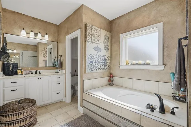 a bathroom with a bathtub and a sink