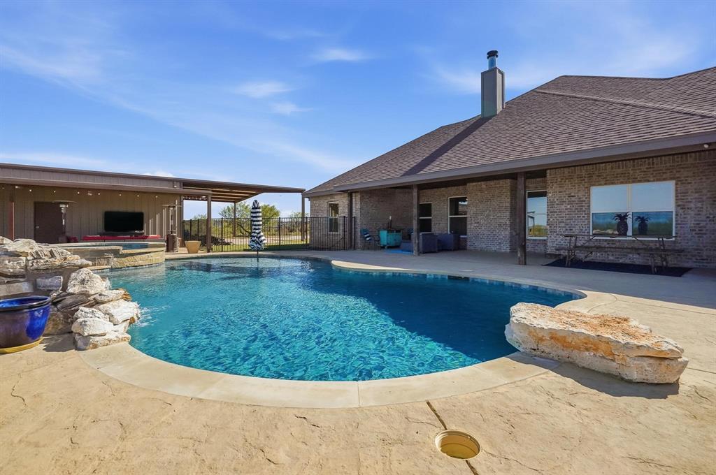 163 Homestead Road Tuscola, TX 79562 - Photo 29 of 40 a view of a house with backyard porch and sitting area