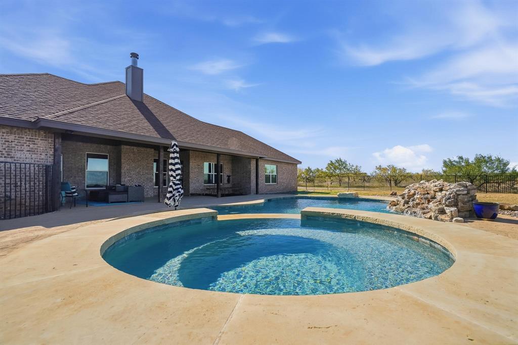 163 Homestead Road Tuscola, TX 79562 - Photo 30 of 40 a view of a house with swimming pool and sitting area