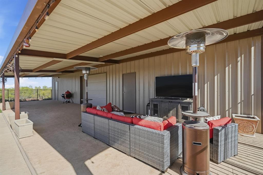 163 Homestead Road Tuscola, TX 79562 - Photo 31 of 40 a living room with furniture and a flat screen tv