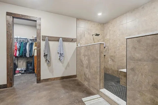 a bathroom with a shower and a sink