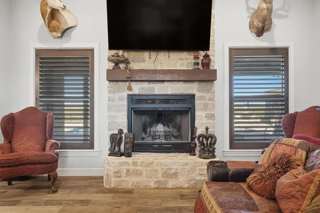 a living room with furniture and a fireplace