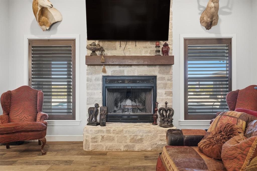 163 Homestead Road Tuscola, TX 79562 - Photo 7 of 40 a living room with furniture and a fireplace