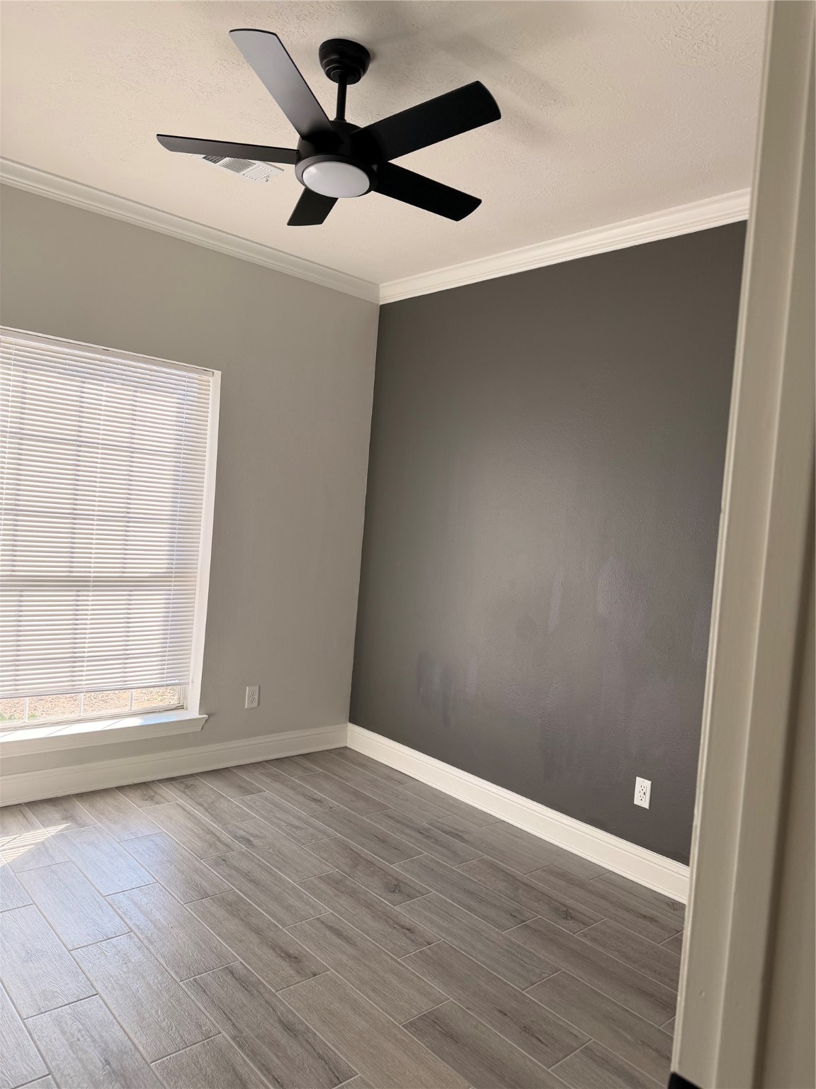 2839 Autumn Springs Lane Spring, TX 77373 - Photo 11 of 49 an empty room with wooden floor fan and windows