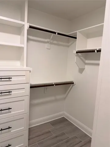 a view of an empty walk in closet