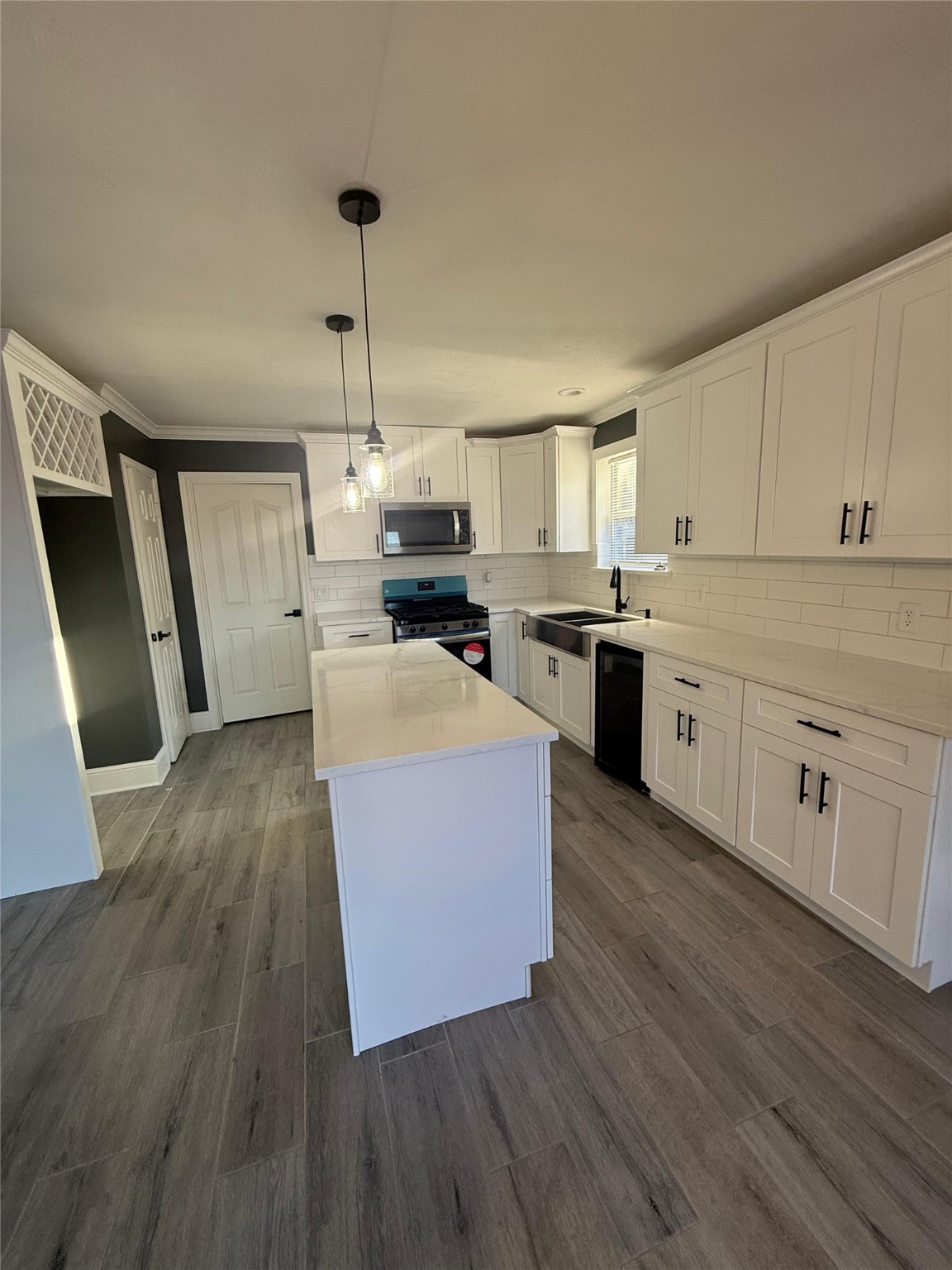 2839 Autumn Springs Lane Spring, TX 77373 - Photo 38 of 49 a kitchen with wooden floors and wooden cabinets