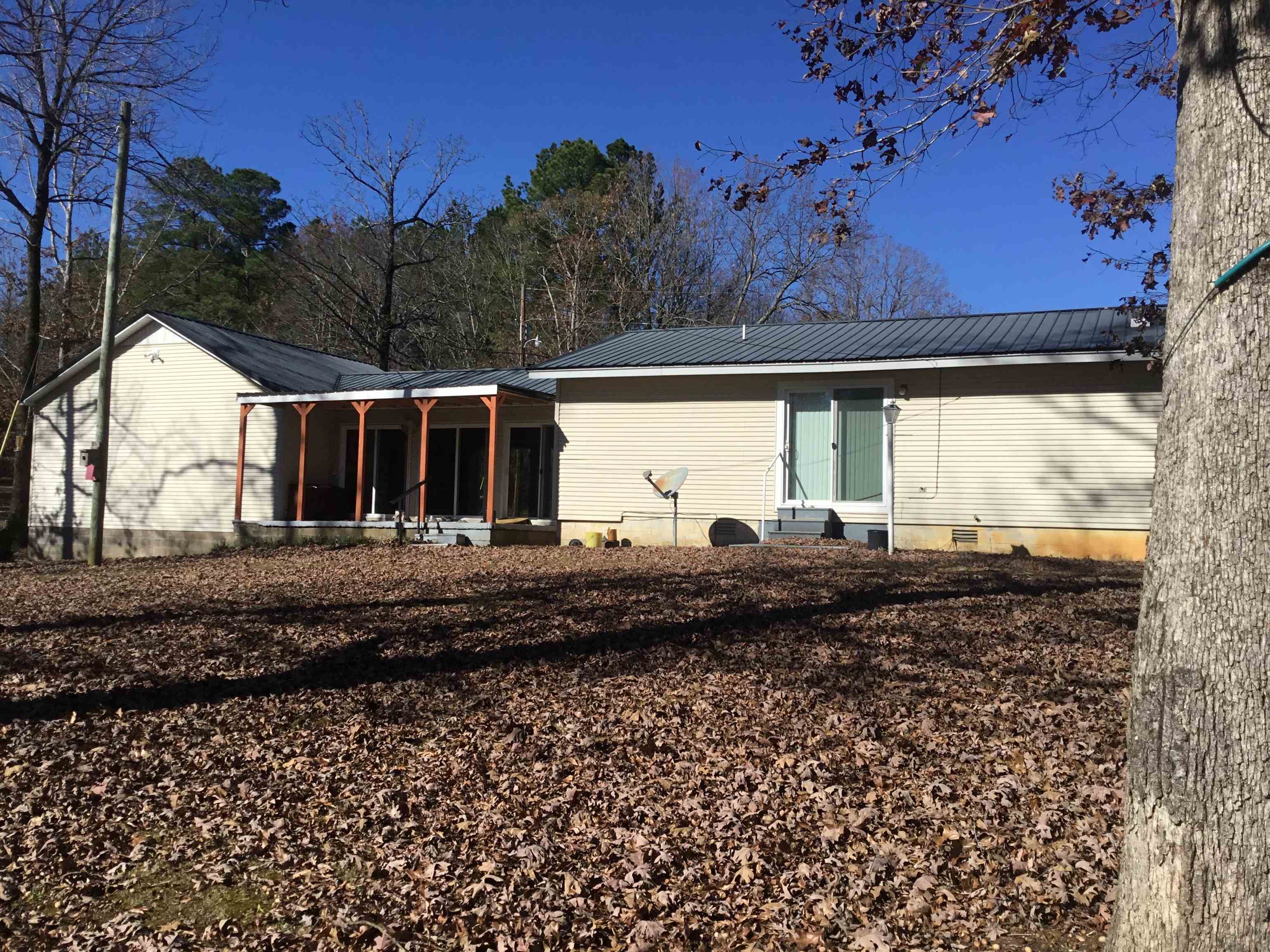 367 Crabtree Road Selmer, TN 38375 - Photo 16 of 23 Rear view of house with a metal roof, crawl space, and a porch