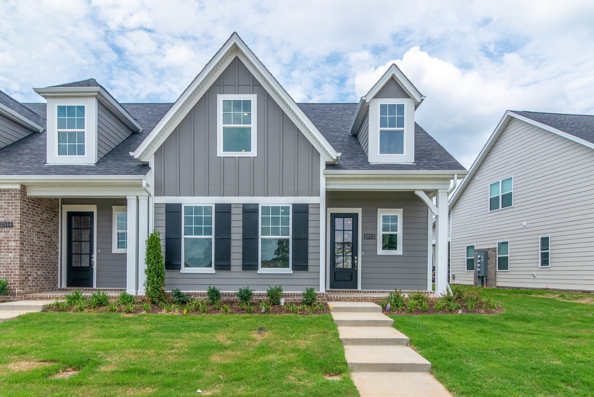 3138 Arbor Vly Road, Unit H8 Spring Hill, TN 37174 - Photo 17 of 27 a front view of a house with a yard