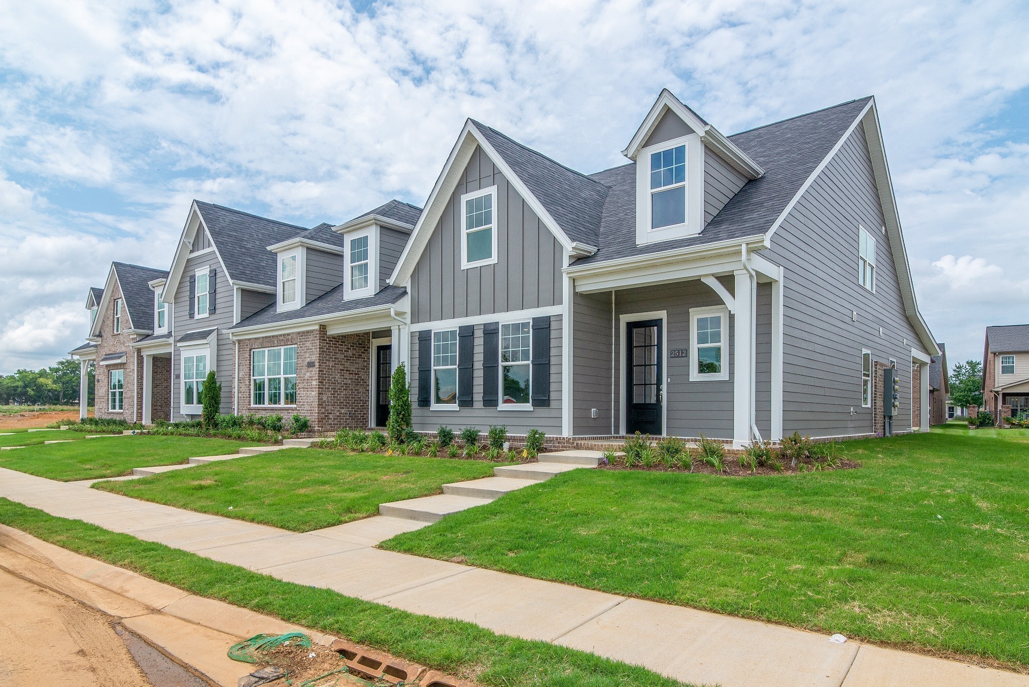 3138 Arbor Vly Road, Unit H8 Spring Hill, TN 37174 - Photo 4 of 27 a front view of a house with a yard
