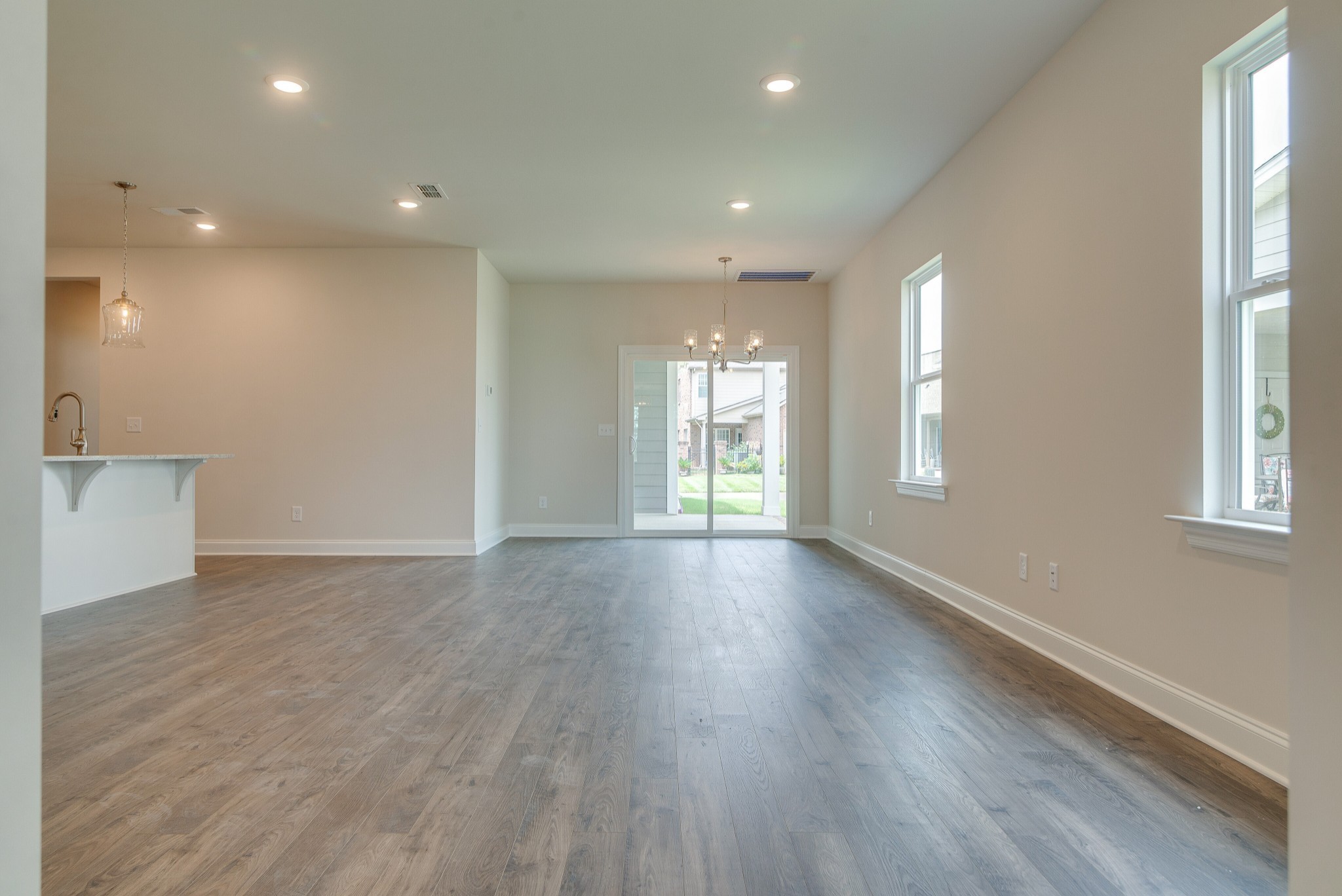 3138 Arbor Vly Road, Unit H8 Spring Hill, TN 37174 - Photo 8 of 27 a view of an empty room with wooden floor and a window