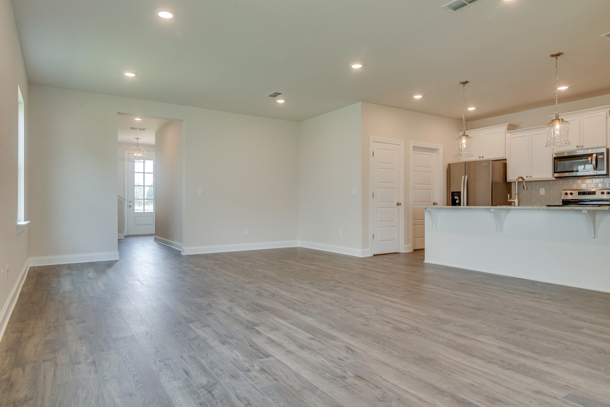 3138 Arbor Vly Road, Unit H8 Spring Hill, TN 37174 - Photo 9 of 27 a view of a kitchen with a sink and a refrigerator
