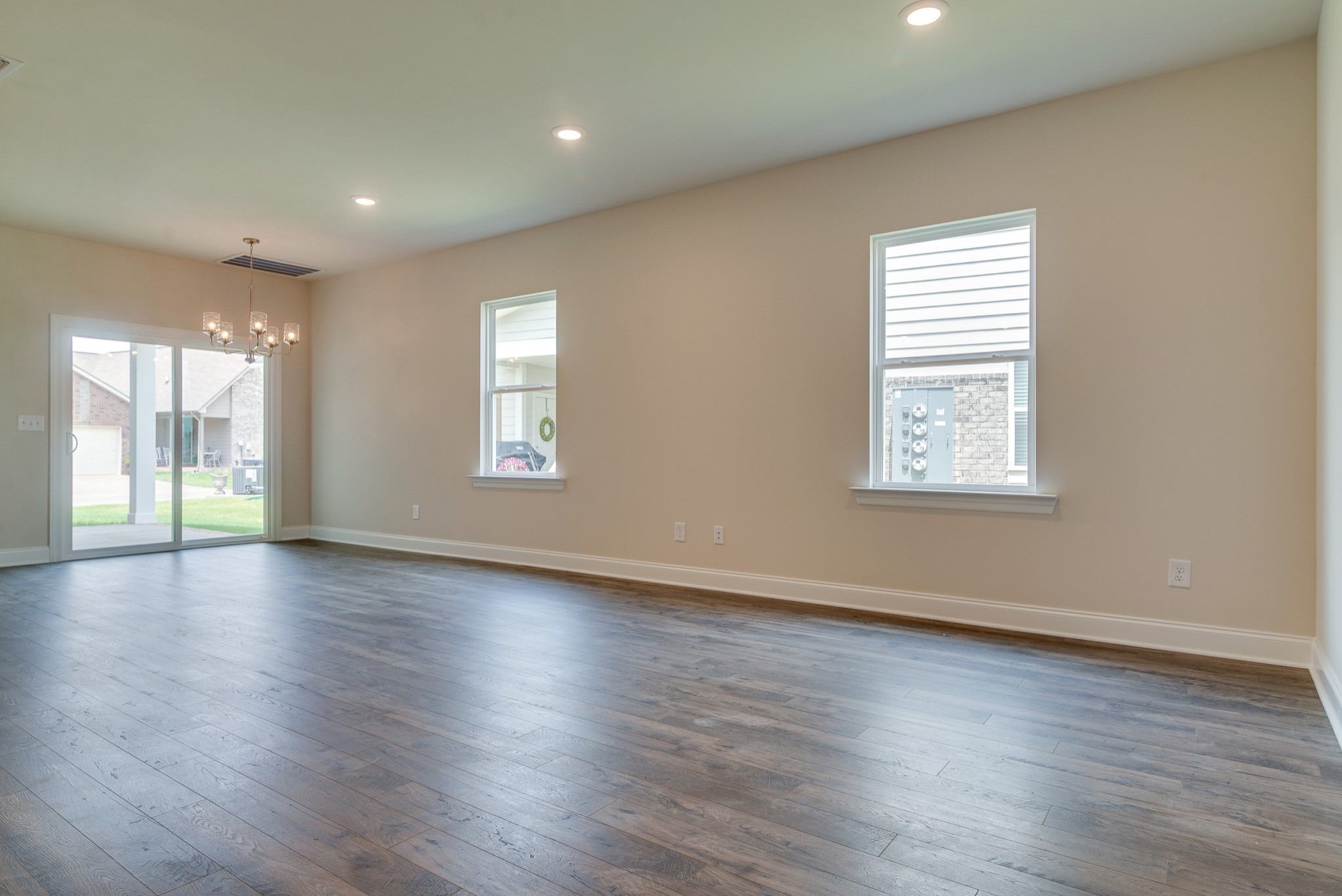 3138 Arbor Vly Road, Unit H8 Spring Hill, TN 37174 - Photo 10 of 27 an empty room with wooden floor and windows
