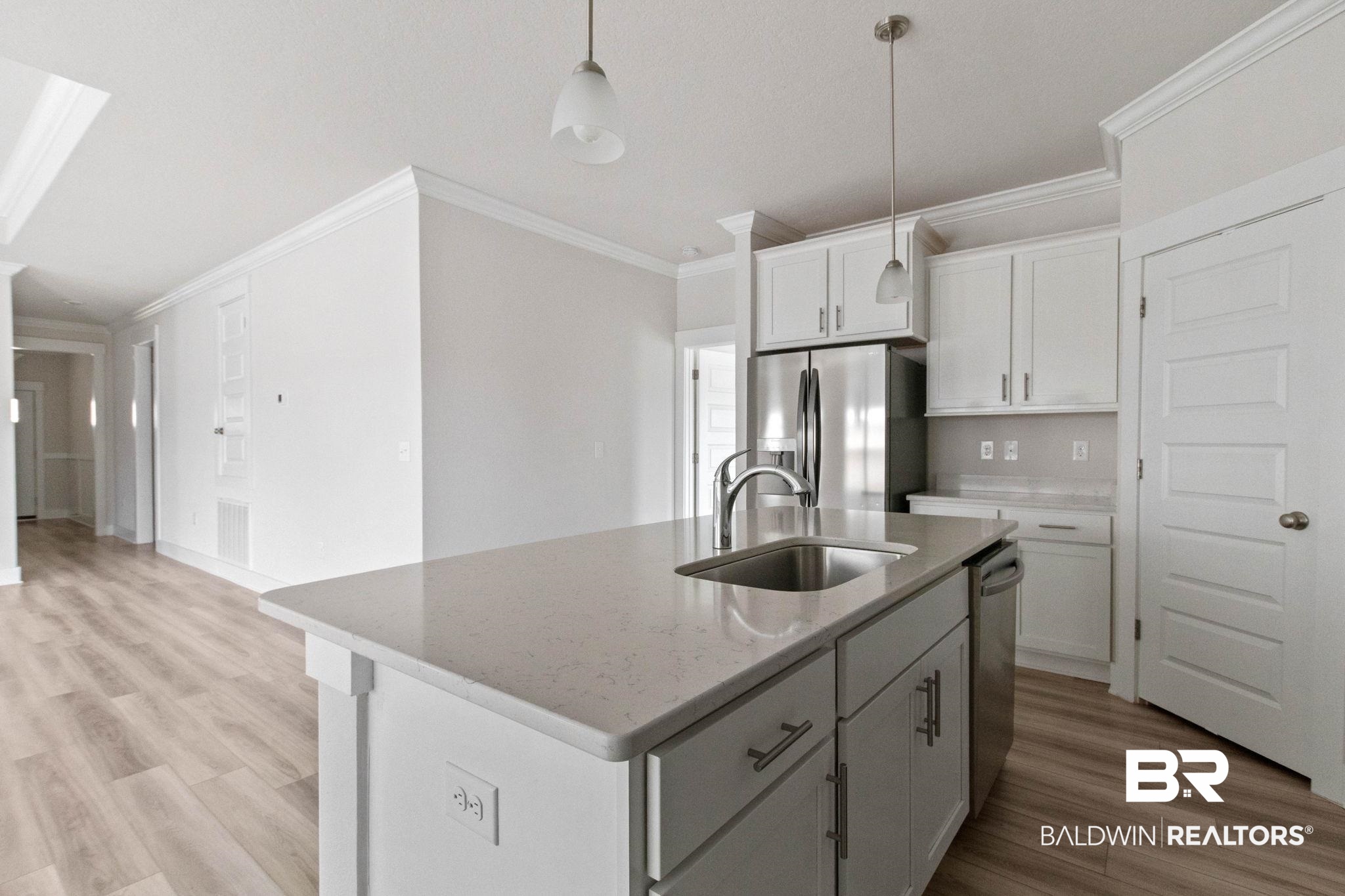 1710 Grouse Street Foley, AL 36535 - Photo 31 of 76 Kitchen island with integrated stainless steel sink and gooseneck faucet