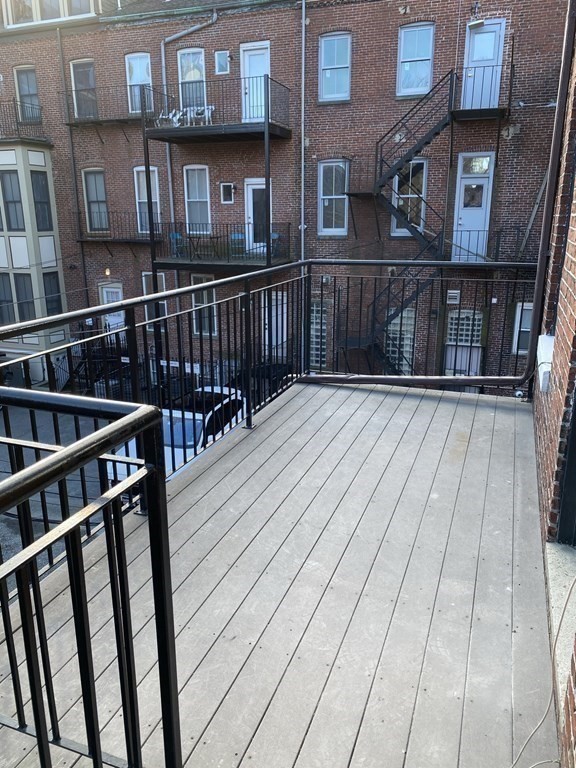 1 Wigglesworth Street, Unit 2 Boston, MA 02120 - Photo 13 of 23 a view of wooden balcony