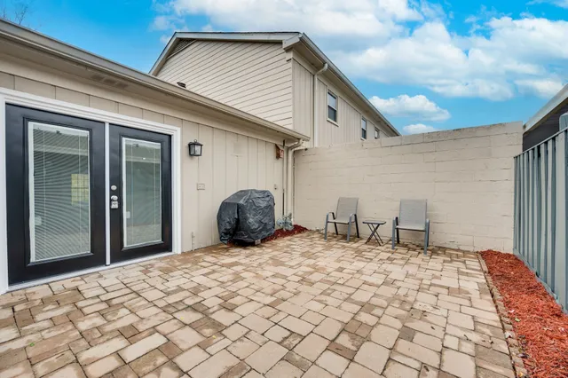 a view of parking space with a car parked in garage