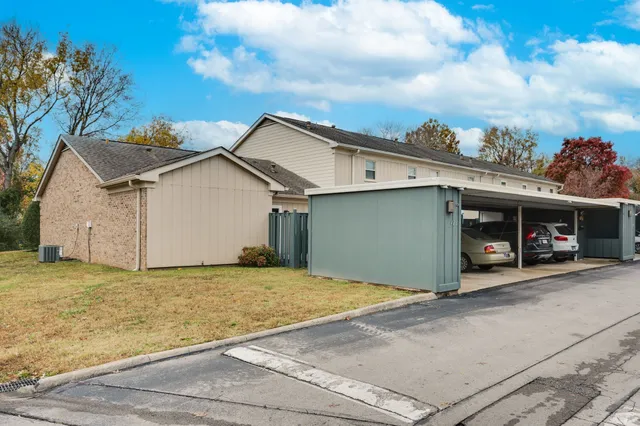 a view of a park with swings and trees