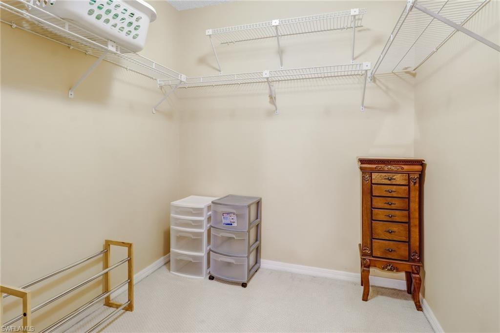 5675 Whitaker Road, Unit B202 Naples, FL 34112 - Photo 15 of 26 a view of a room with racks on the wall