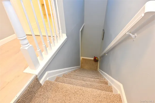 a view of a big room with wooden floor and furniture