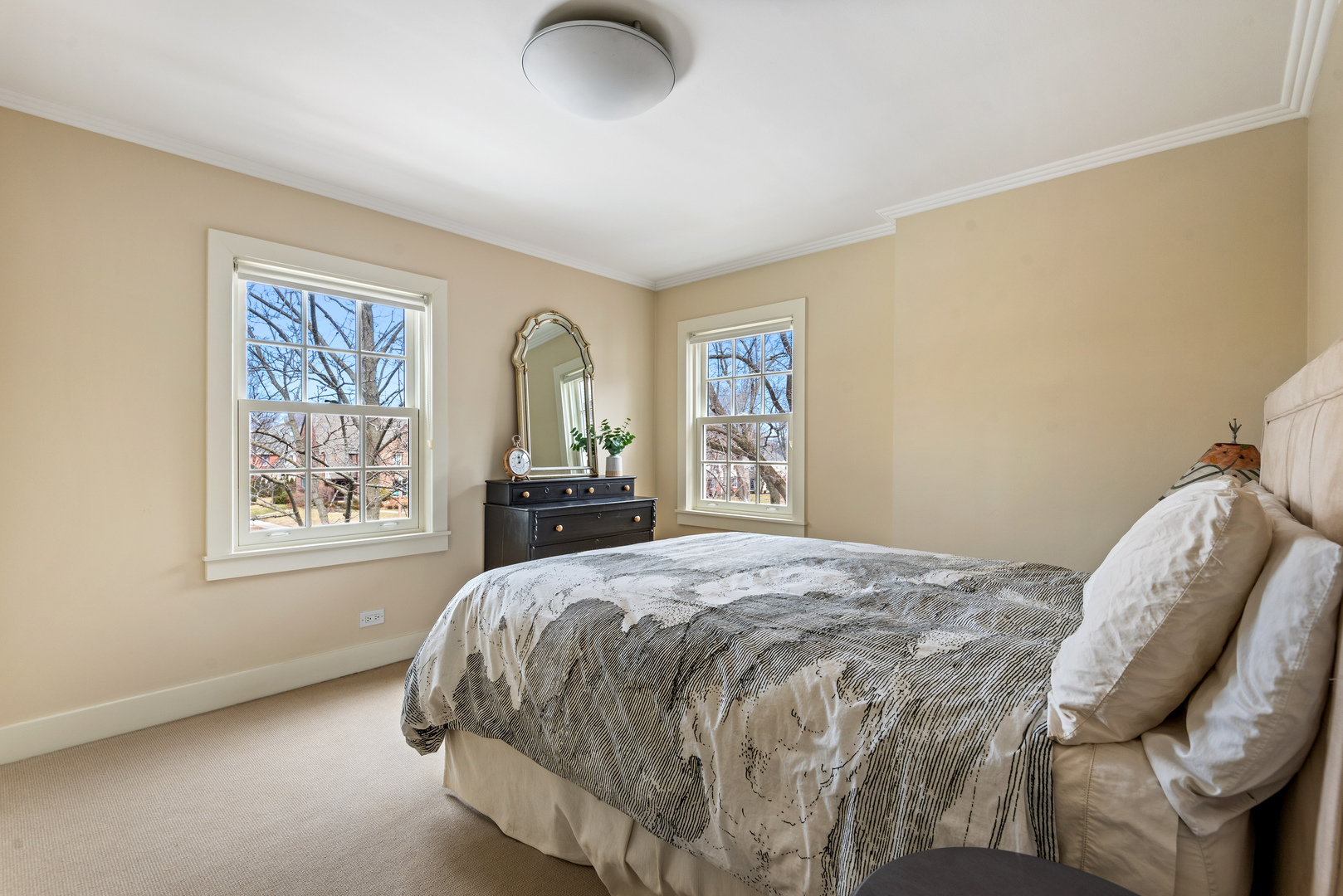 700 Park Drive Kenilworth, IL 60043 - Photo 23 of 34 a bedroom with a bed and dresser with window